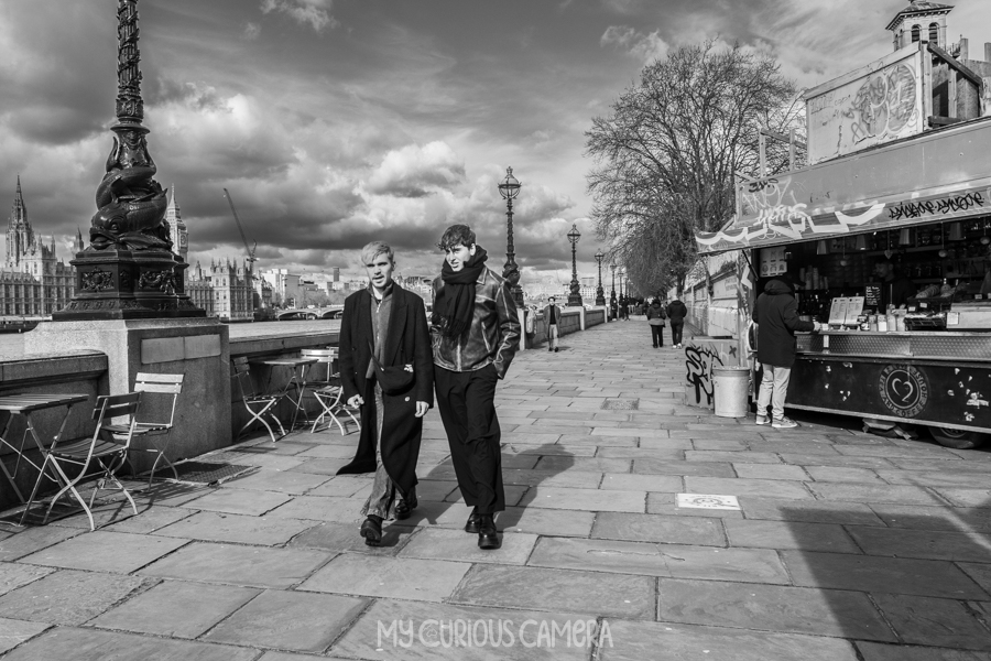 Two men walking down the Southbank