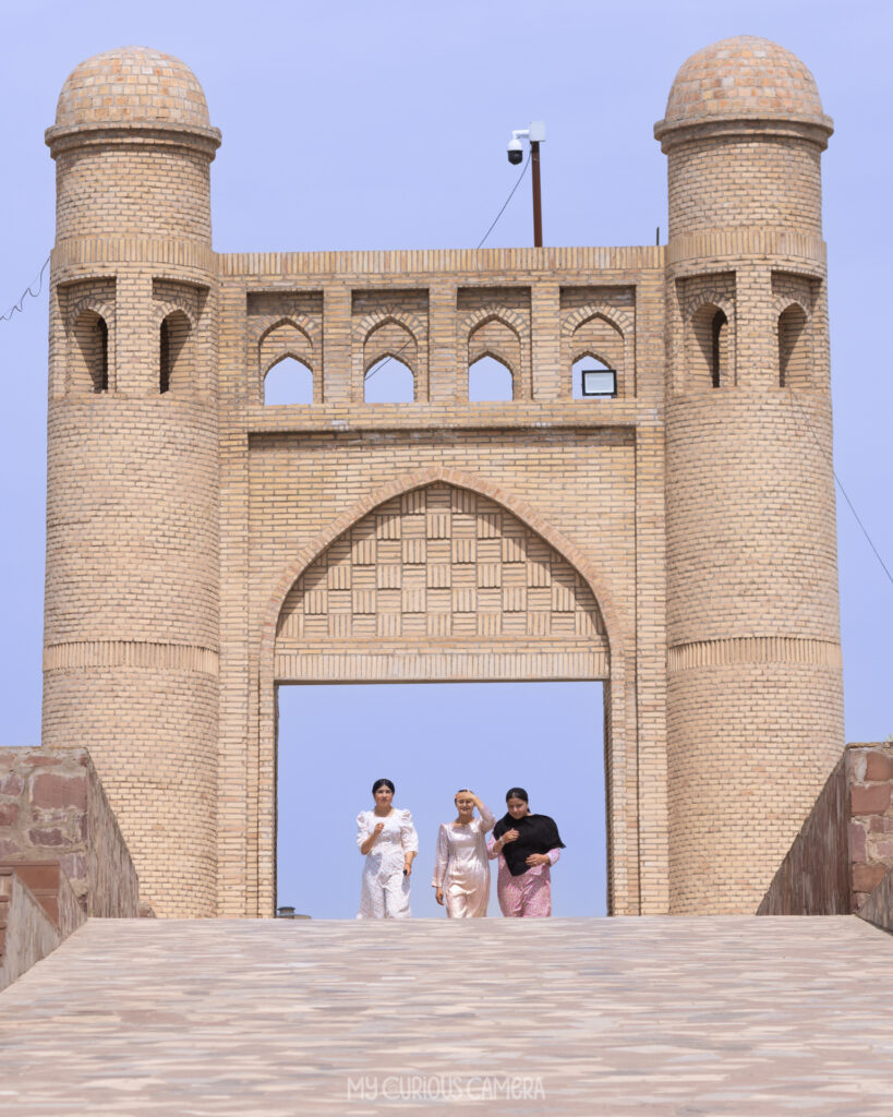 two massive cylindrical defensive towers flanking a grand arched portal. This served as the heavily fortified main entrance to the citadel, which was the royal residence of the governor (Bek) under the ⁠Emirate of Bukhara.