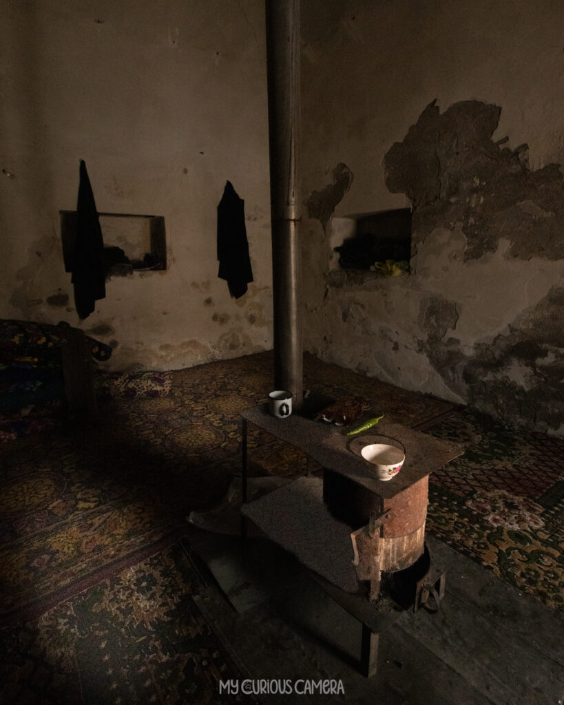 A recreated student cell shows how young scholars once lived while studying at the madrassa. The central burjuyka stove provided warmth and somewhere to prepare simple meals, while small wall niches (taqcha) stored books, lamps and treasured possessions.
